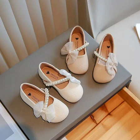 Bowknot Slanted Pearl Strap Girls' Flat Shoe.