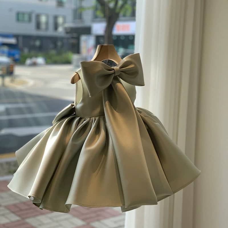 Asymetrical Twirl Bow Pleated Ball Gown
