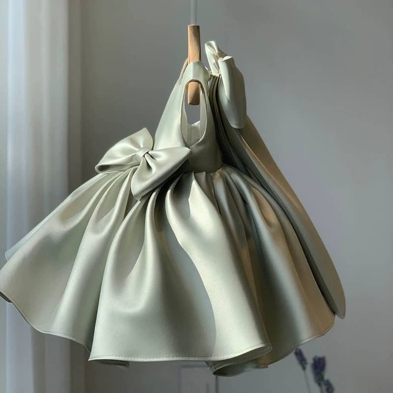 Asymetrical Twirl Bow Pleated Ball Gown